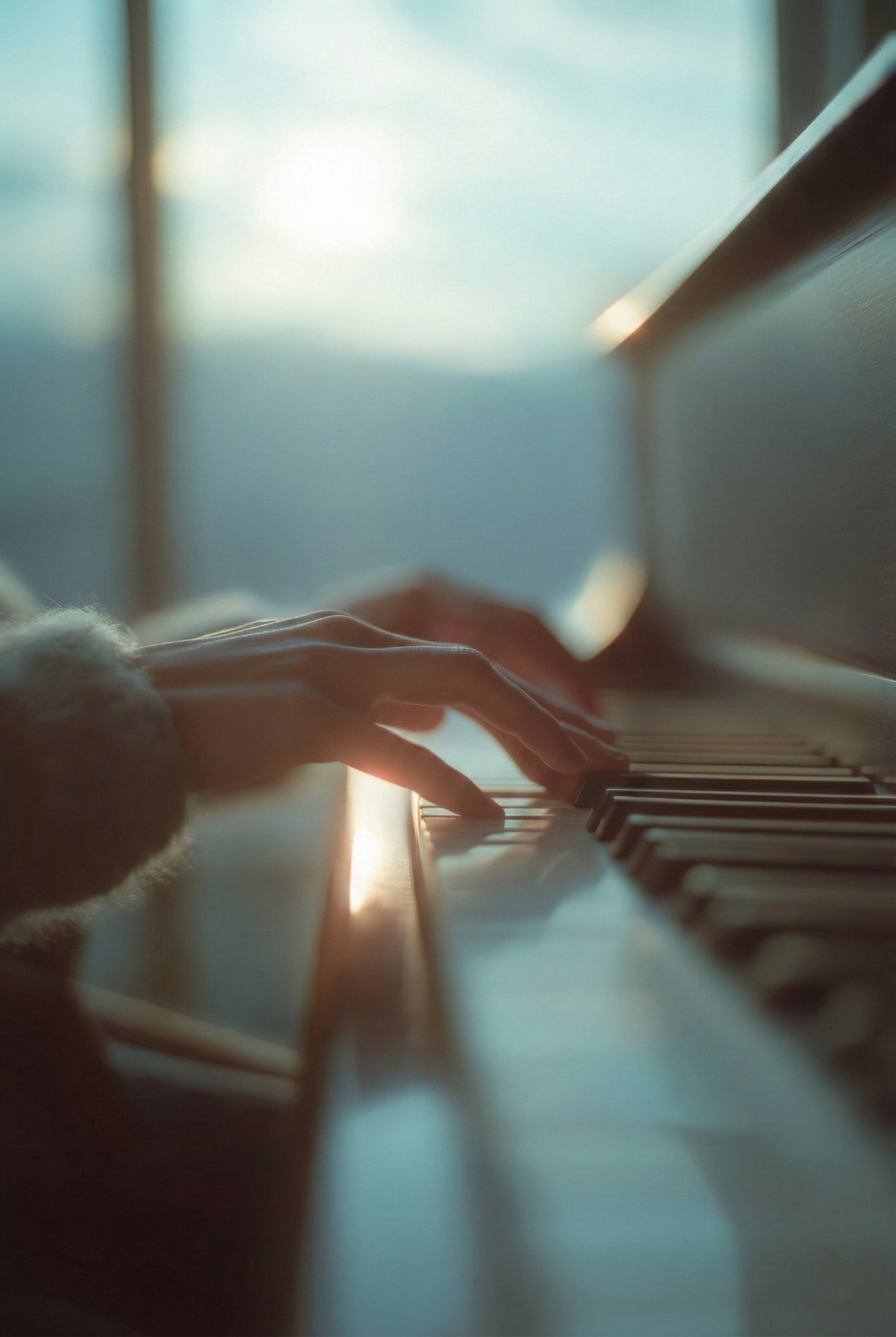 Child's hands on piano keys during an in-home lesson — developing artistry and technique
