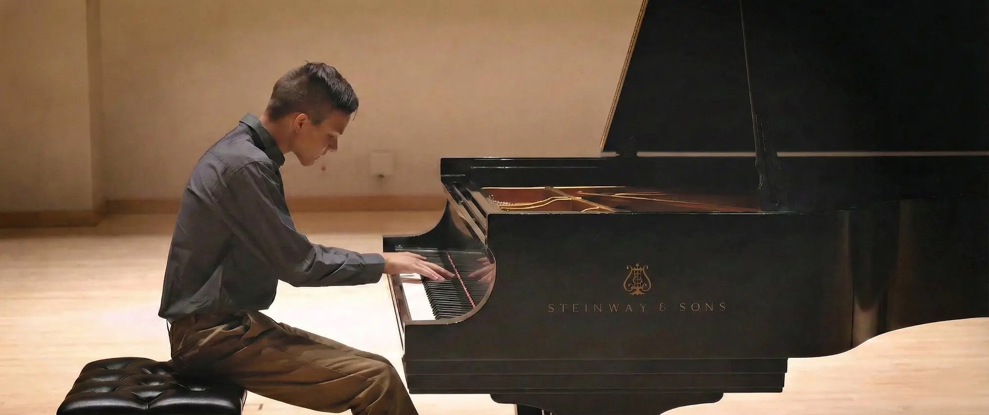 East Cobb piano student performing Rachmaninoff on a Steinway at recital